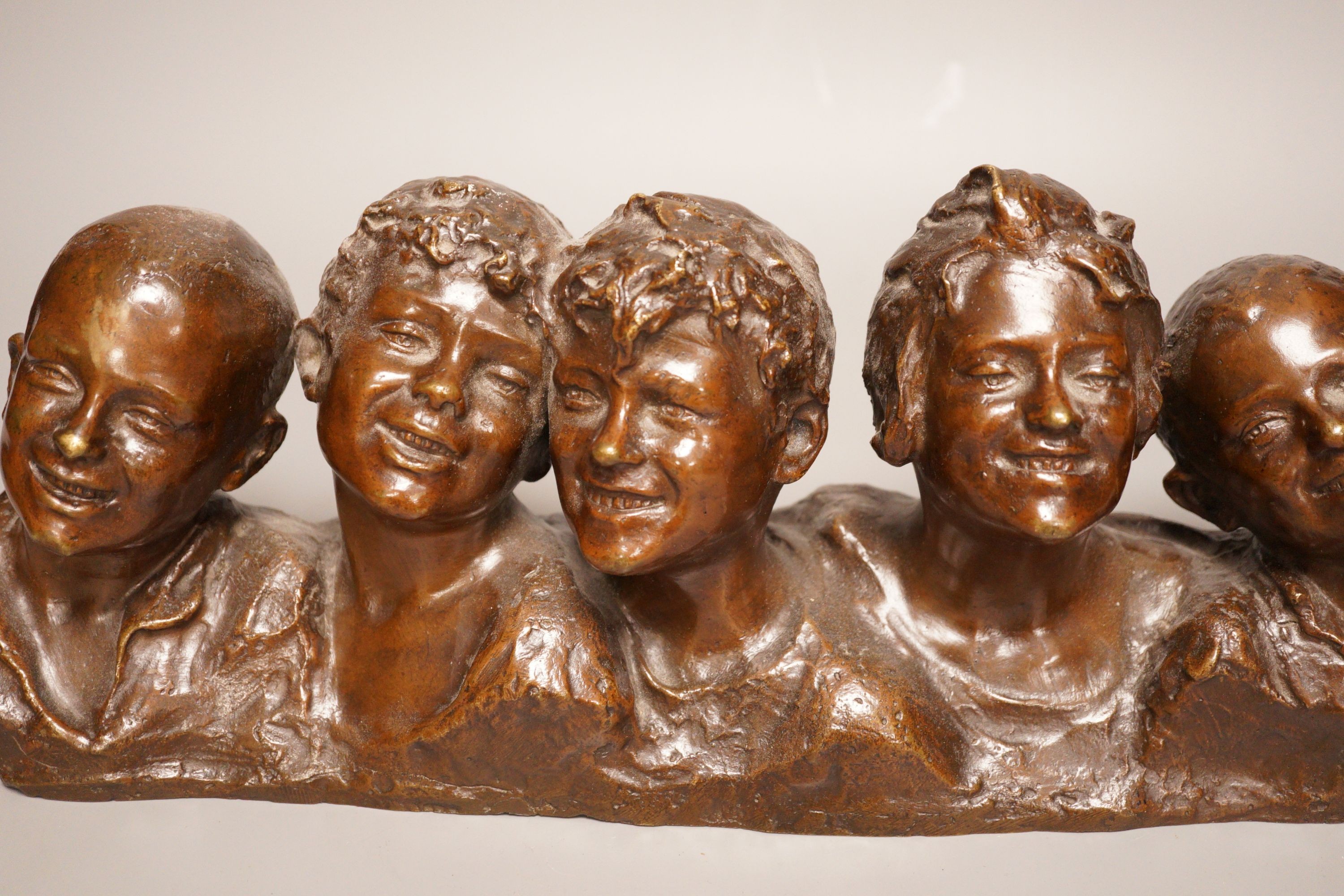 Vincenzo Aurisicchio, (Napoli 1855-1926) a bronze bust group of five smiling children, signed to reverse 40cm wide